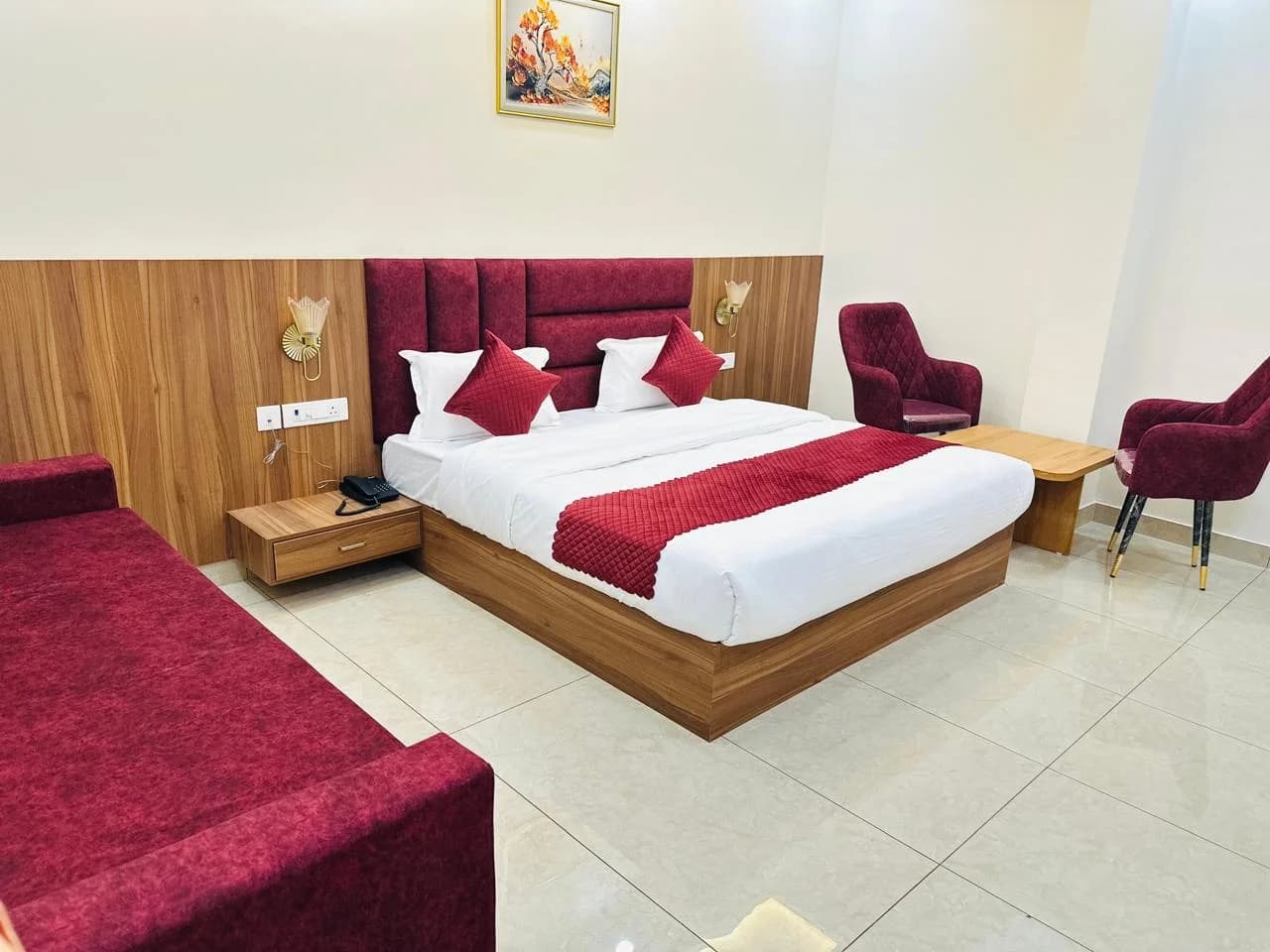 Heritage Suite room showing traditional wooden craftsmanship and plush king bed